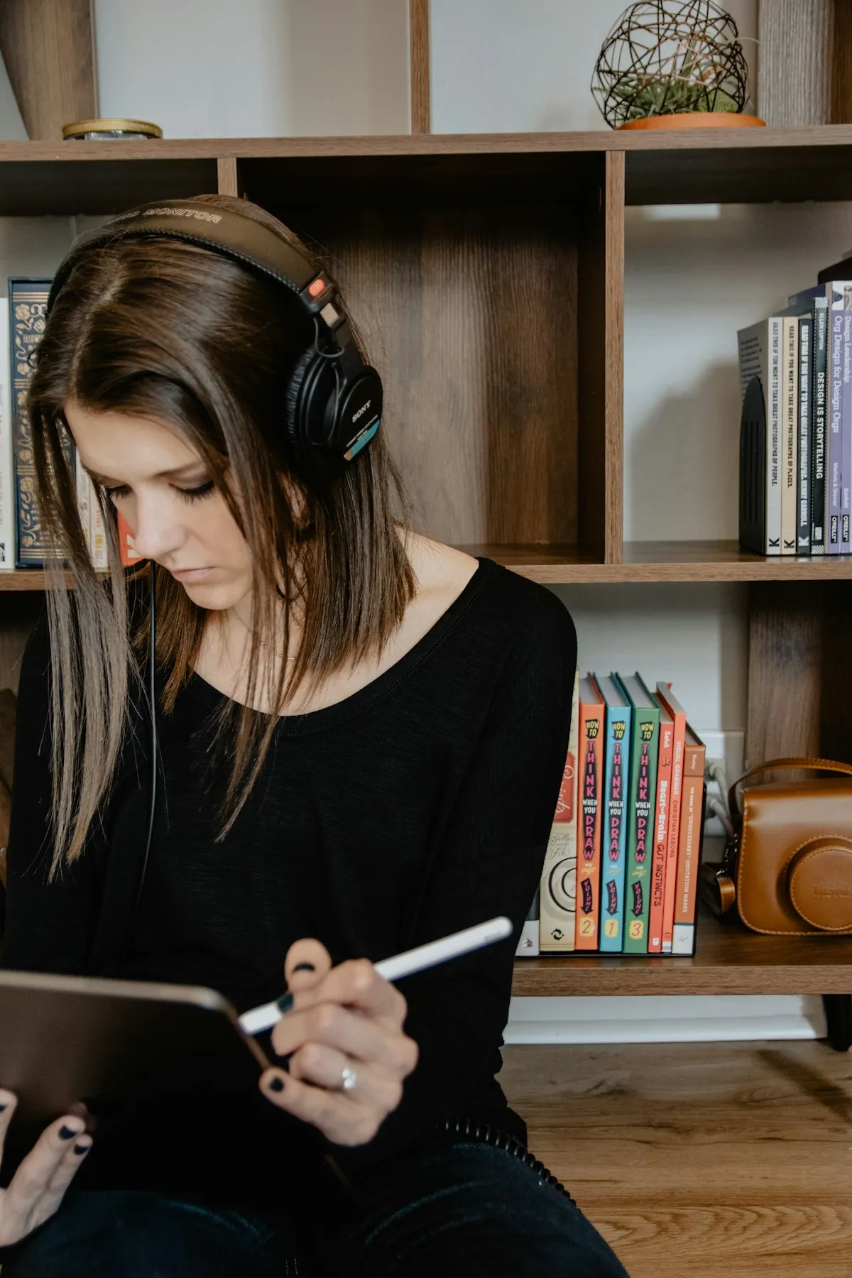 Person wearing headphones, focused on their work